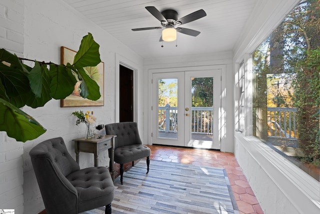 sunroom / solarium with french doors and ceiling fan