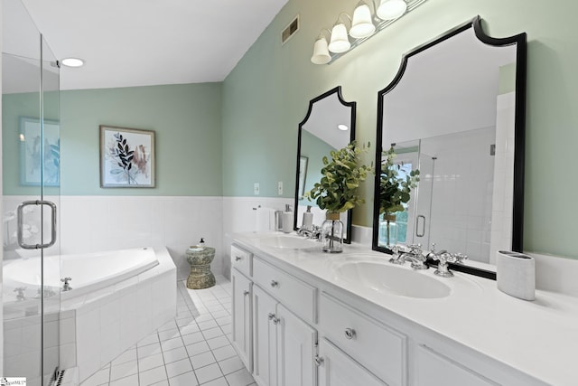 bathroom featuring vanity, tile patterned floors, plus walk in shower, and lofted ceiling