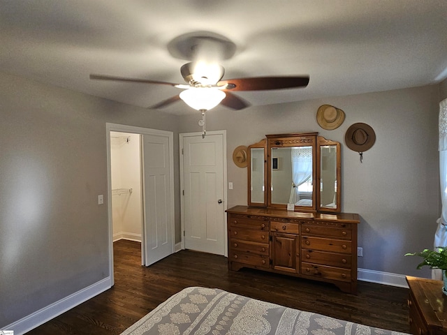 bedroom with ceiling fan and dark hardwood / wood-style floors