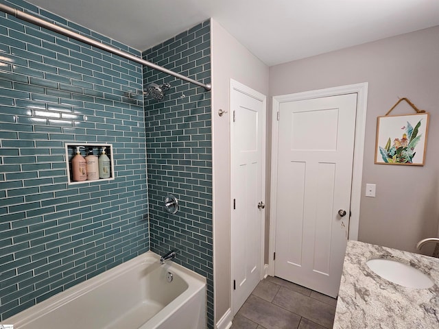 bathroom with vanity, tiled shower / bath, and tile patterned floors