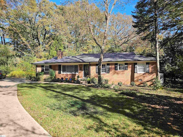 ranch-style house with a front yard