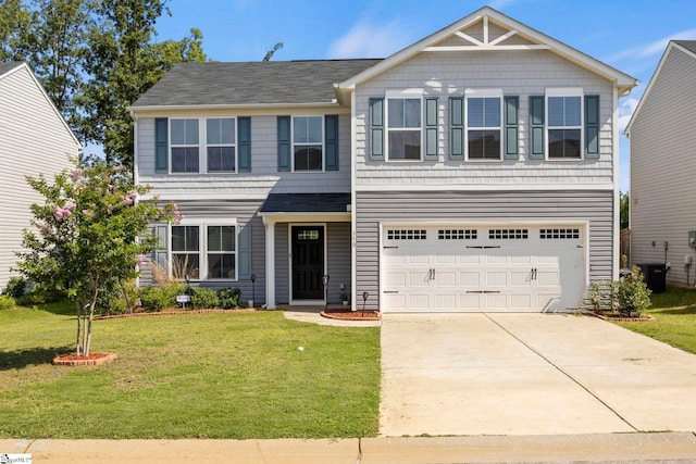 view of front facade with a garage, central AC, and a front yard