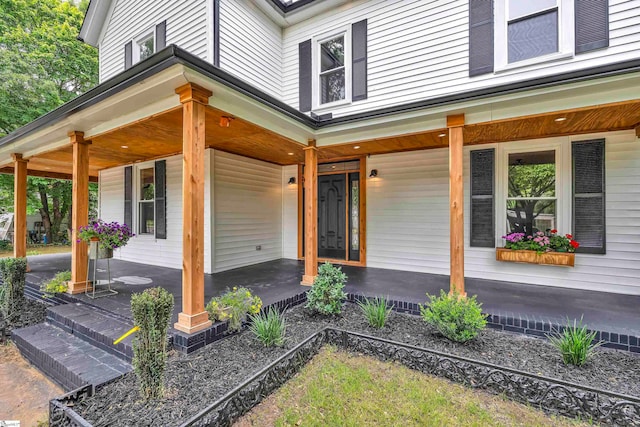 doorway to property featuring a porch