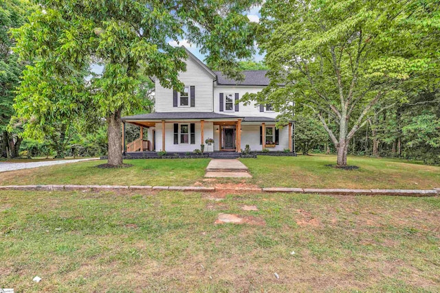 view of front of property with a porch and a front lawn