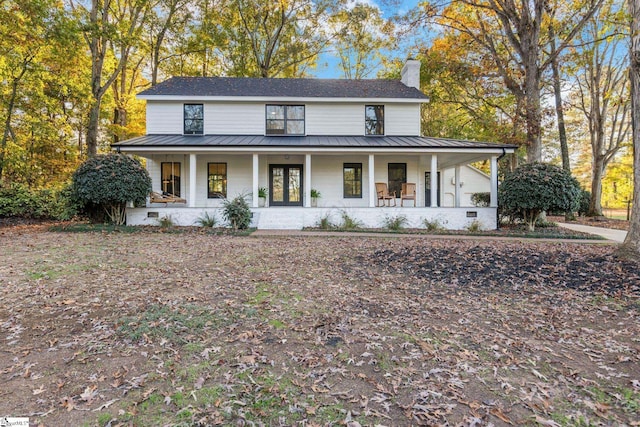 modern inspired farmhouse featuring covered porch