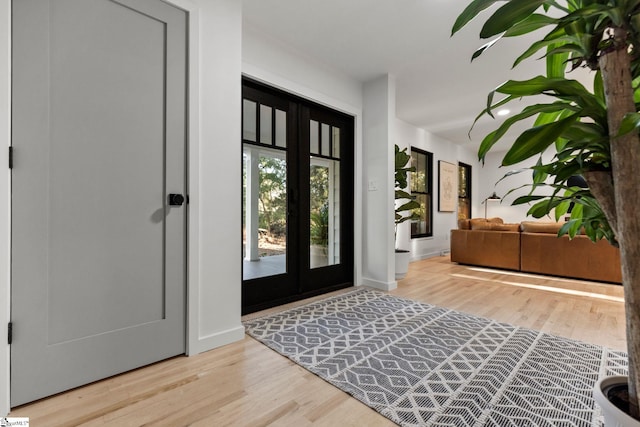 entryway featuring french doors and light hardwood / wood-style floors