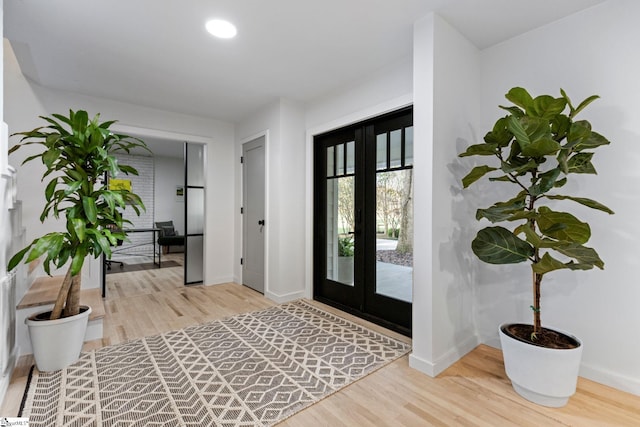 foyer with french doors and wood-type flooring