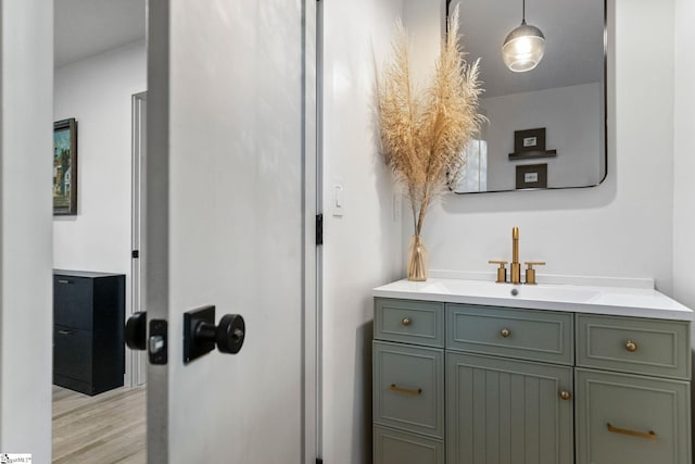 bathroom with vanity and hardwood / wood-style floors