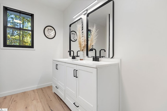 bathroom featuring hardwood / wood-style floors and vanity