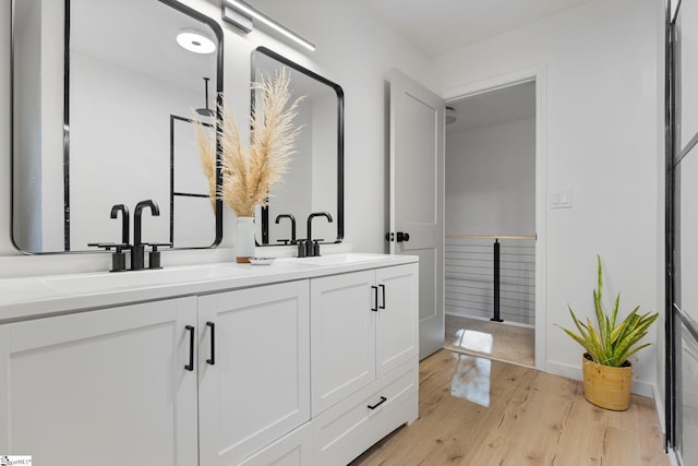 bathroom featuring hardwood / wood-style floors and vanity