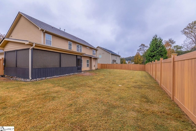 rear view of house with a yard