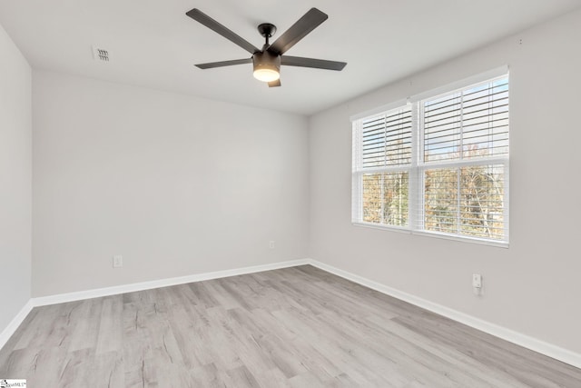 empty room featuring ceiling fan and light wood-type flooring