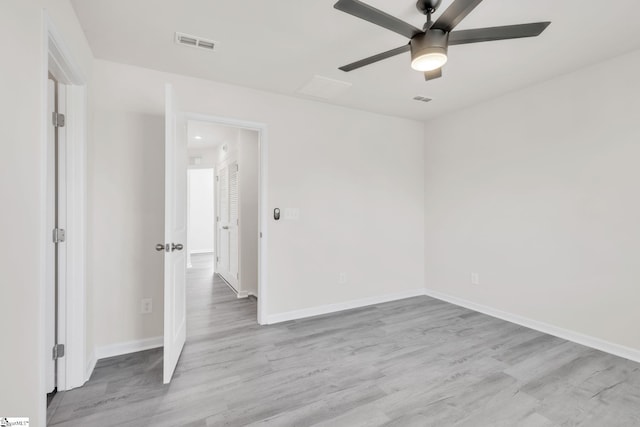 unfurnished room featuring ceiling fan and light wood-type flooring