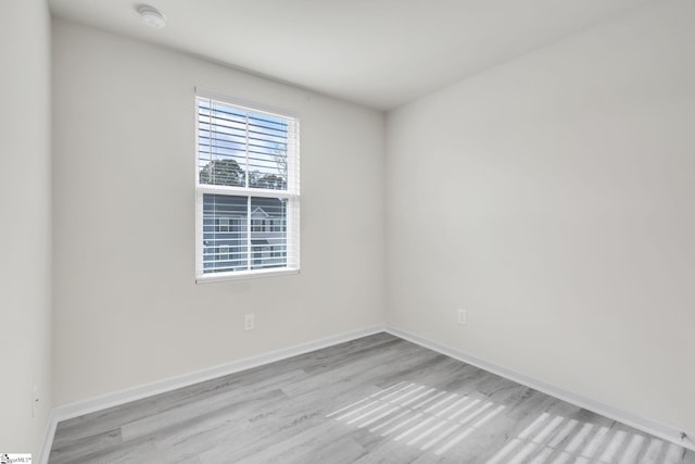 spare room with light wood-type flooring