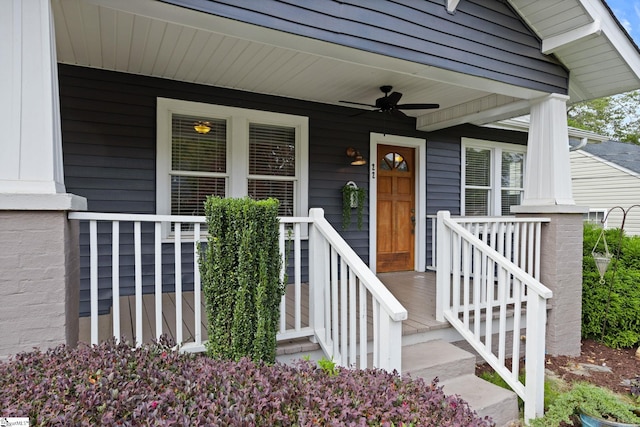 entrance to property featuring ceiling fan and covered porch