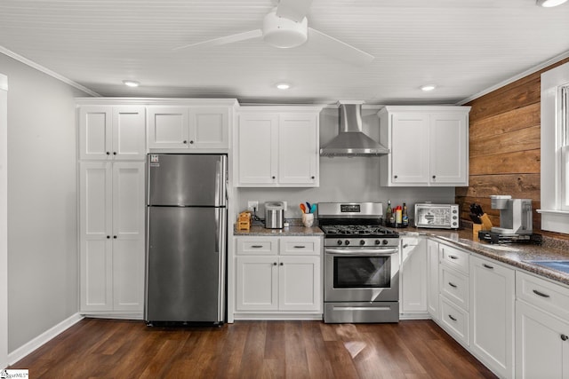 kitchen with white cabinets, wall chimney exhaust hood, dark hardwood / wood-style floors, and stainless steel appliances