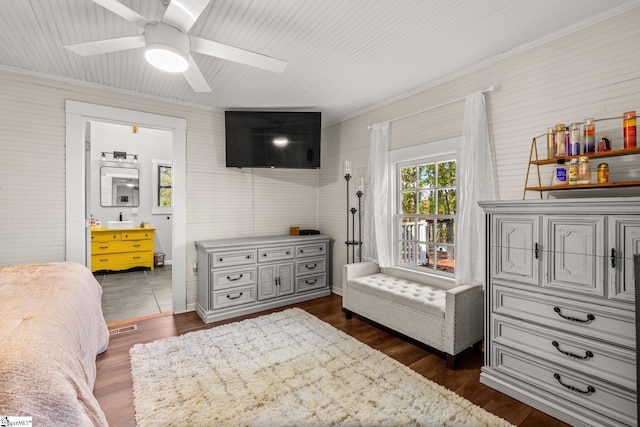 bedroom with ceiling fan, dark hardwood / wood-style floors, and crown molding