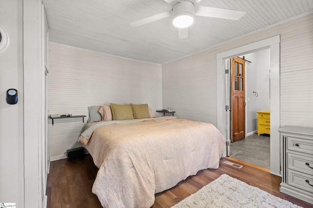 bedroom featuring ceiling fan and dark hardwood / wood-style floors