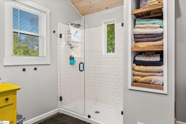 bathroom with a shower with door