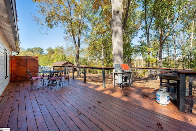 wooden deck featuring area for grilling