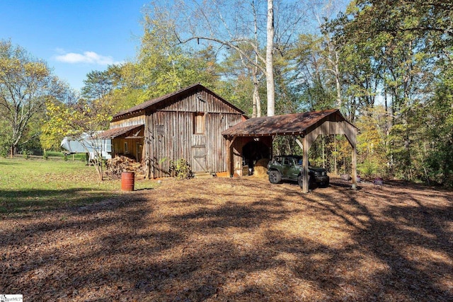 exterior space with a yard and a carport