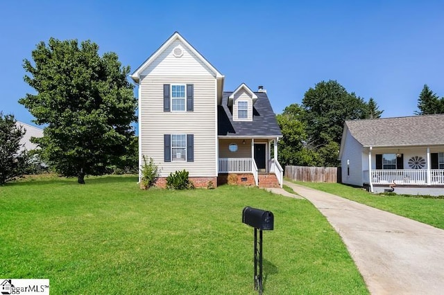 view of front of property featuring covered porch and a front yard