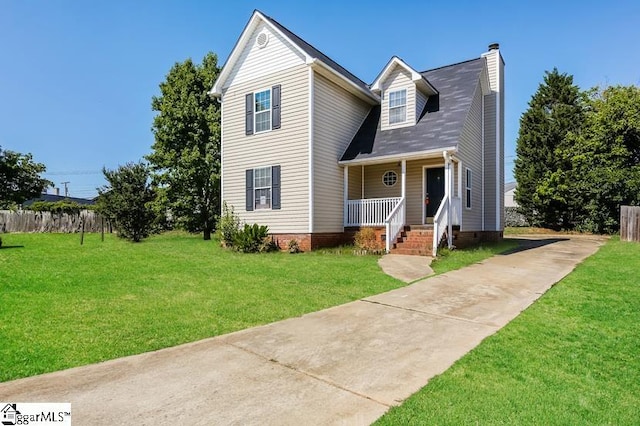 view of front of property with a front yard and covered porch