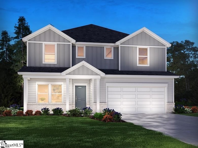 view of front facade featuring a garage and a front yard