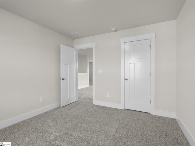 unfurnished bedroom featuring carpet