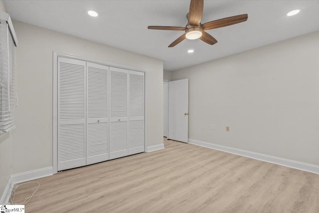 unfurnished bedroom with a closet, ceiling fan, and light hardwood / wood-style flooring