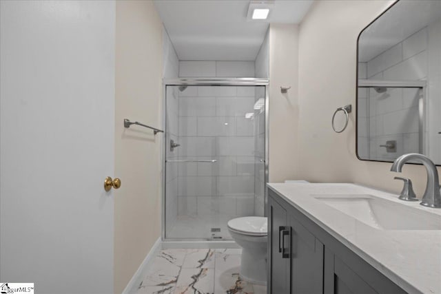 bathroom featuring an enclosed shower, vanity, and toilet