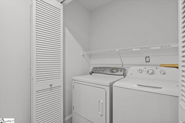 laundry room featuring washing machine and dryer