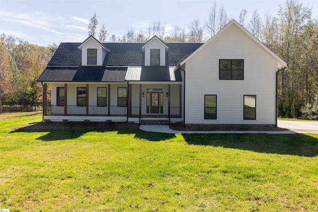 view of front of home with a front yard and covered porch