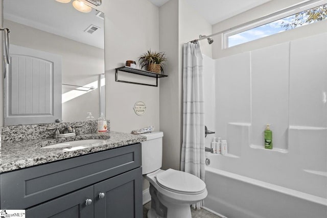 full bathroom with vanity, toilet, and shower / tub combo with curtain