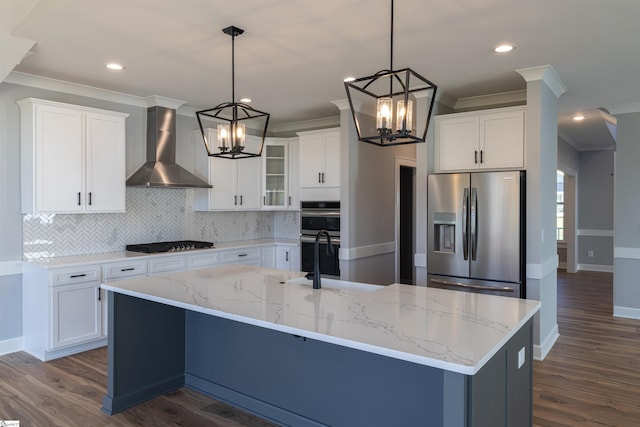 kitchen featuring white cabinetry, a center island with sink, wall chimney range hood, dark hardwood / wood-style floors, and stainless steel appliances