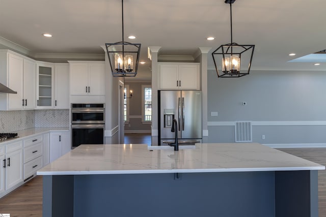 kitchen featuring pendant lighting, a center island, and stainless steel appliances