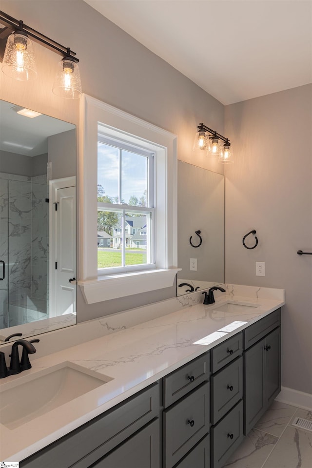 bathroom featuring vanity and a shower with shower door