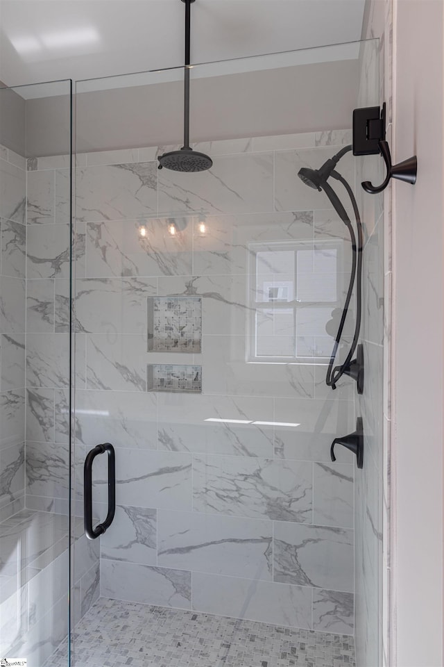 bathroom with a shower with shower door