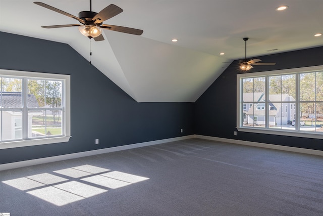 additional living space featuring vaulted ceiling, a wealth of natural light, and carpet floors