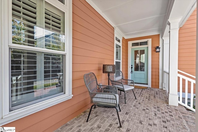 entrance to property featuring a porch