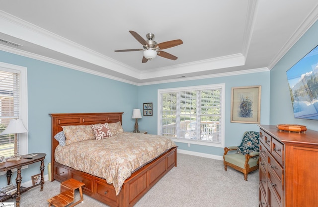 bedroom with ceiling fan, multiple windows, and light carpet