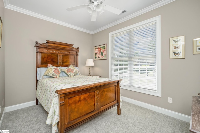 carpeted bedroom featuring ceiling fan and ornamental molding