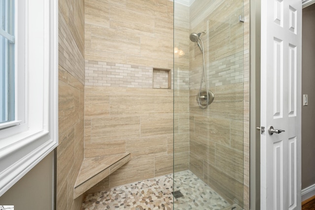 bathroom featuring a tile shower