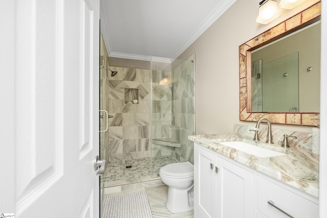 bathroom featuring vanity, toilet, crown molding, tile patterned flooring, and a shower with shower door