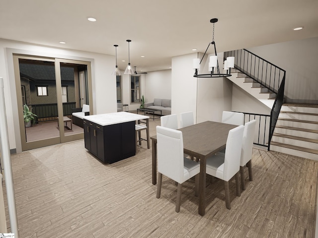 dining space featuring a notable chandelier and light hardwood / wood-style flooring