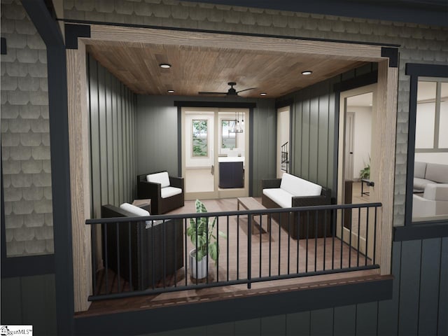 wooden deck featuring a ceiling fan