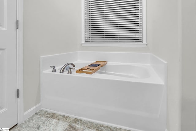 bathroom with a tub