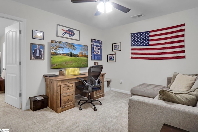 home office featuring light colored carpet and ceiling fan