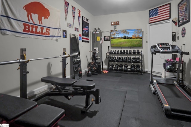 workout room featuring water heater