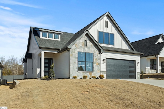 108 Cambie Pl, Greenville, SC 29607 - modern farmhouse featuring stone siding, driveway, board and batten siding, an attached garage, and a shingled roof